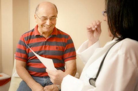 Doctor welcoming a senior patient