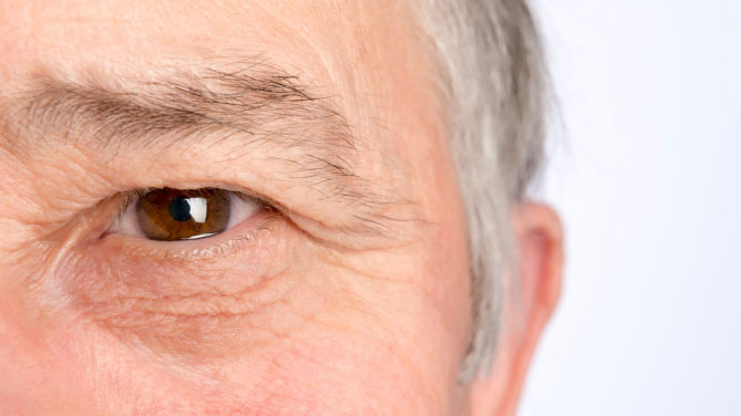 Focus on a senior man eye