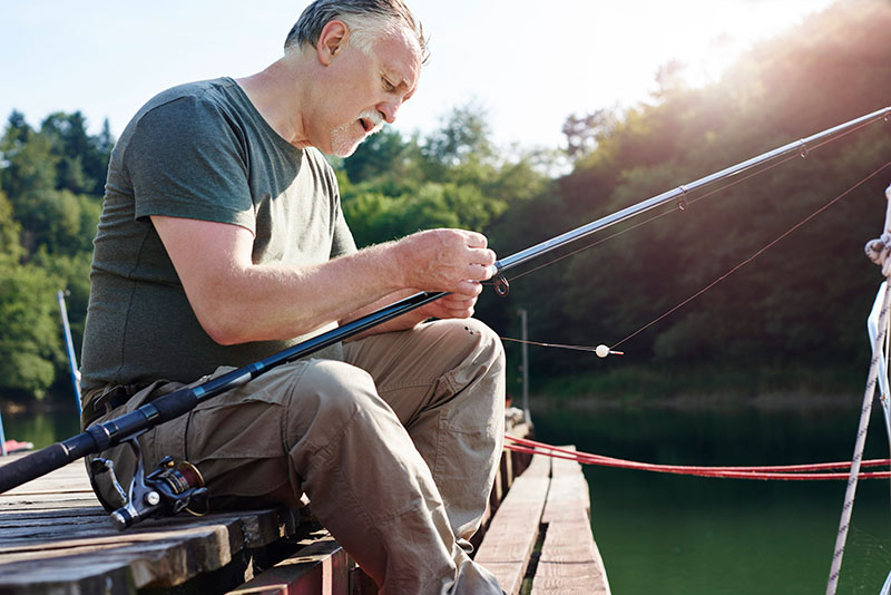 Senior man fishing at the lake